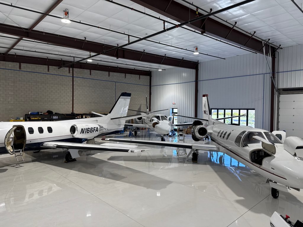 hangar with 3 airplanes